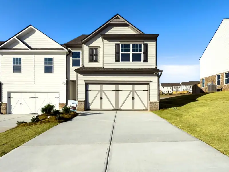 Front exterior of a home in the The Retreat at Browns Ridge community, located in Newnan, GA (Image 11).