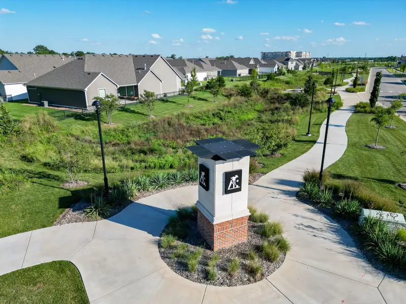 Entrance to the The Courtyards at The Heritage community in Andover, KS, featuring signage and landscaping (Image 2). Entrance to the The Courtyards at The Heritage community in Andover, KS, featuring signage and landscaping (Image 2).