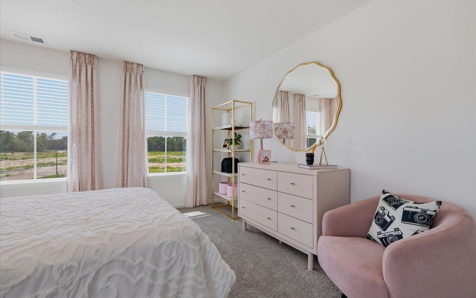 Furnished interior in a model home at Riverwalk Pointe at Mallory Creek - Townhomes in Leland (Image 24). Furnished interior in a model home at Riverwalk Pointe at Mallory Creek - Townhomes in Leland (Image 24).