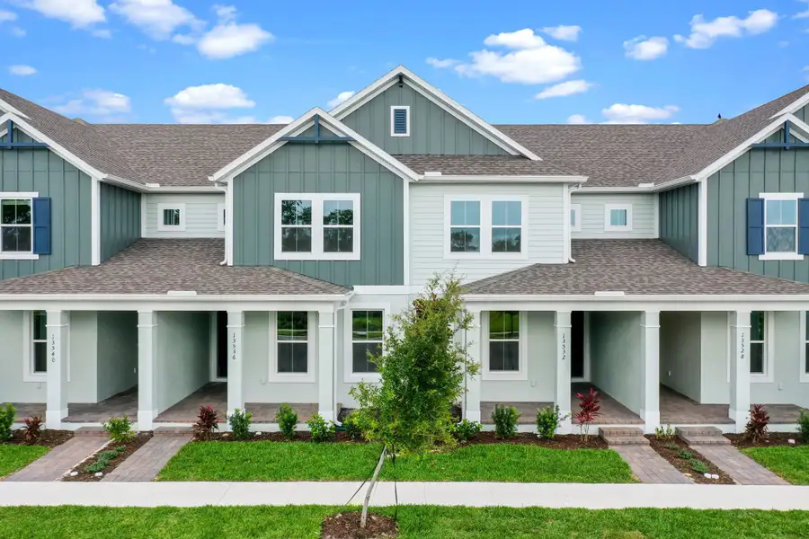 Front exterior of a home in the Harvest at Ovation - Townhomes community, located in Winter Garden, FL (Image 34).