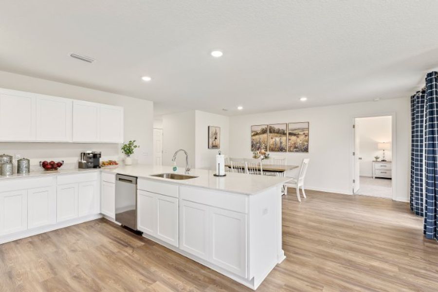 A kitchen with white cabinets. A kitchen with white cabinets.