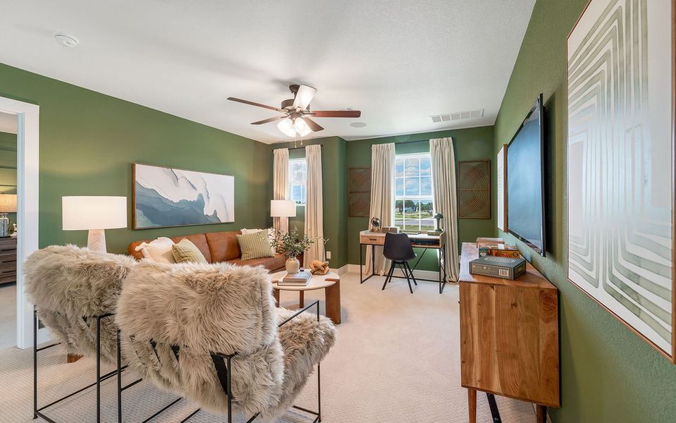 Furnished interior in a model home at Grande Estates in Bertram (Image 31).