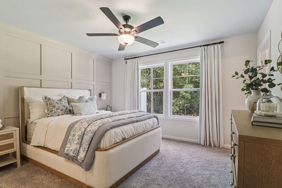 Enjoy a private primary bedroom with plenty of natural light