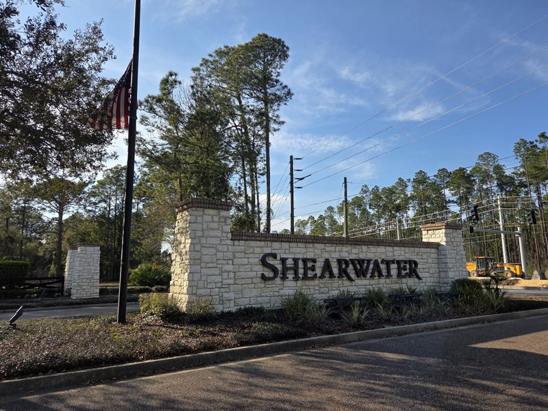 A welcoming stone entrance to Shearwater Townhomes by Ryan Homes in a lush, wooded area of St. Augustine, FL. A welcoming stone entrance to Shearwater Townhomes by Ryan Homes in a lush, wooded area of St. Augustine, FL.