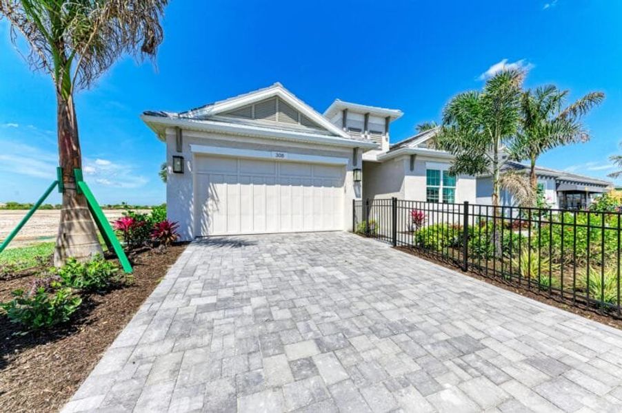 Front exterior of a home in the Inspiration at Watercolor Place community, located in Bradenton, FL (Image 31). Front exterior of a home in the Inspiration at Watercolor Place community, located in Bradenton, FL (Image 31).