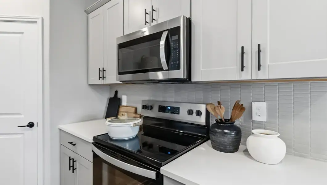 Furnished interior in a model home at The Woodlands at Medina Hills in Mico (Image 27).