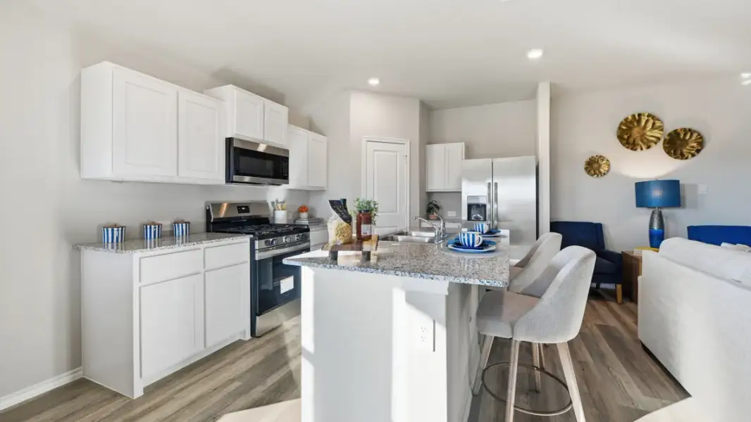 Furnished interior in a model home at Webster Meadows in Ponder (Image 3).