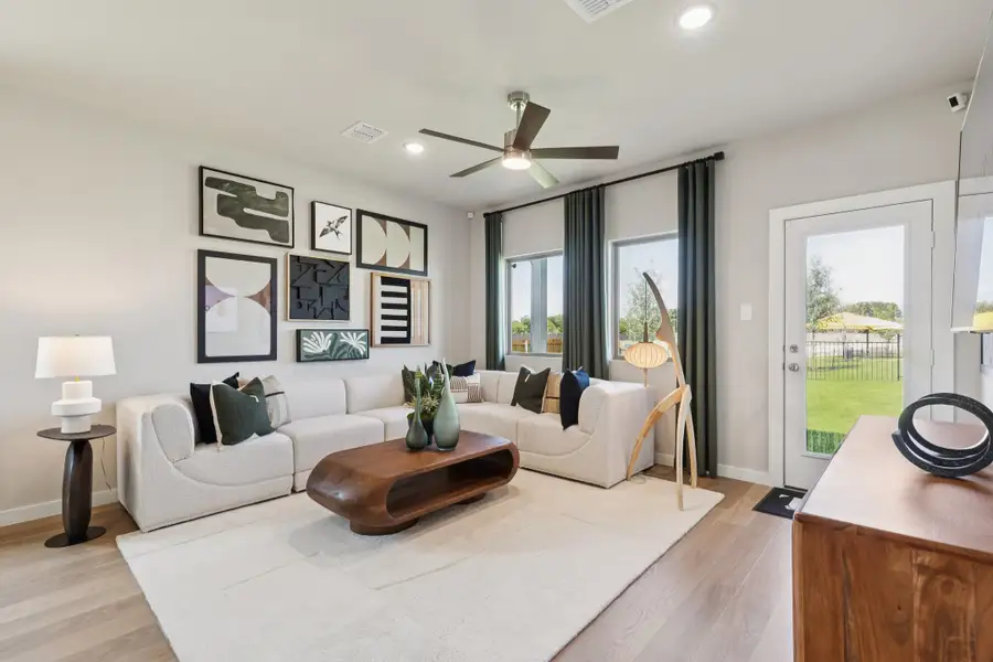 REPRESENTATIVE PHOTO – Living room in a Nicholson Ranch new home in Lavon TX by Trophy Signature Homes