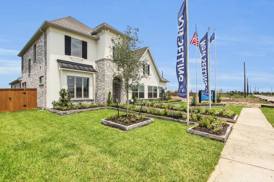 Front exterior of a home in the Canterra Creek  60' community, located in Iowa Colony, TX (Image 2).