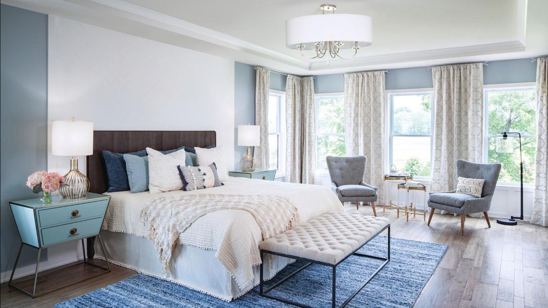 Spacious primary bedroom with space for seating area