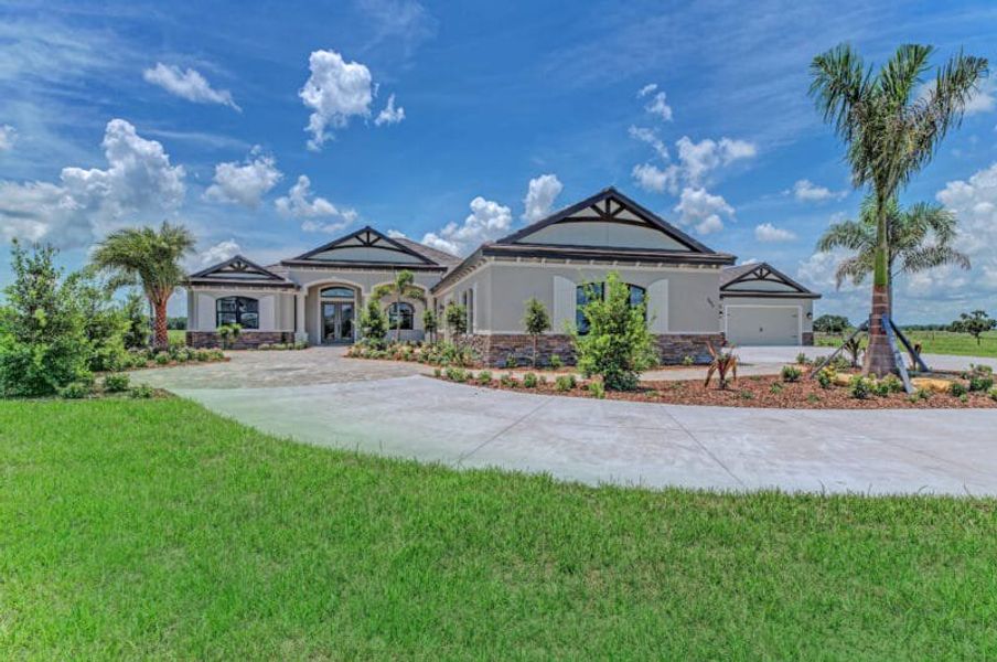 Front exterior of a home in the Hampton Lakes community, located in Sarasota, FL (Image 4). Front exterior of a home in the Hampton Lakes community, located in Sarasota, FL (Image 4).