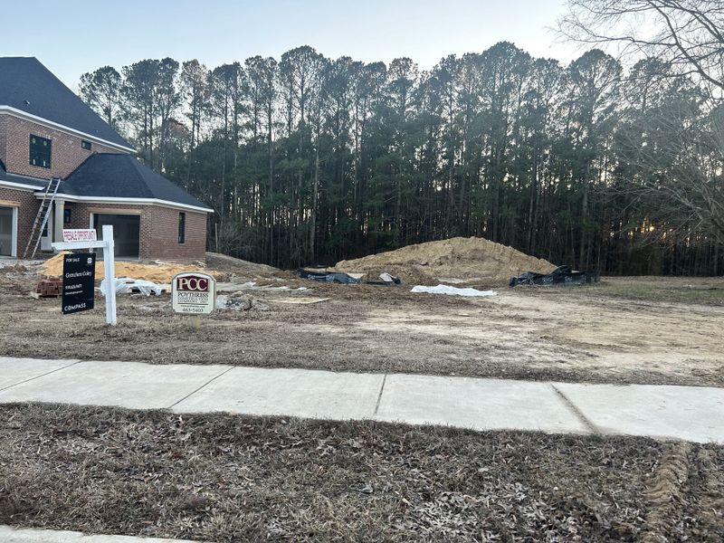 A new brick home under construction in Montvale at Copperleaf by Upright Builders, nestled in a wooded area of Cary, NC. A new brick home under construction in Montvale at Copperleaf by Upright Builders, nestled in a wooded area of Cary, NC.