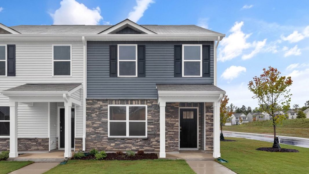 Front exterior of a home in the The Townes at Matthews Landing community, located in Fuquay Varina, NC (Image 5).