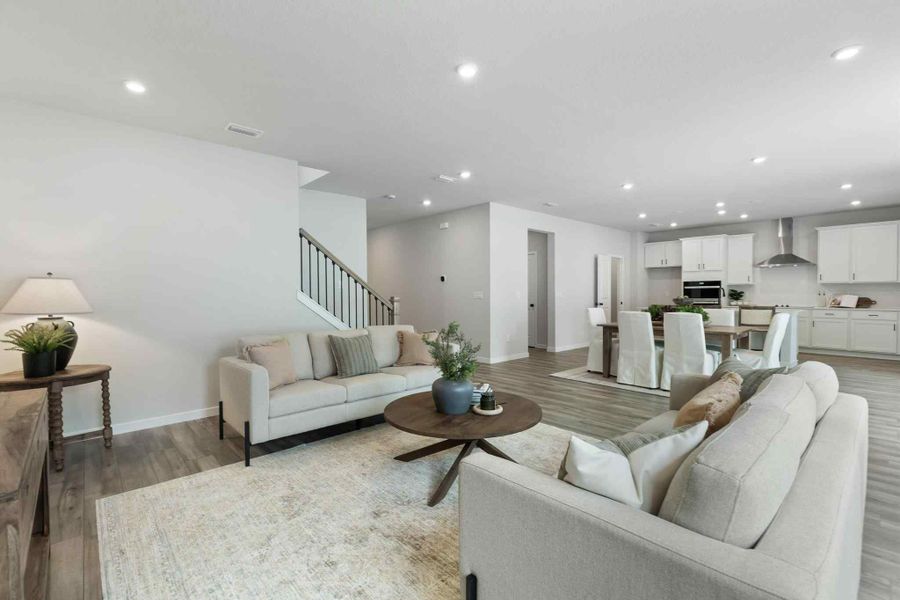A large living room with a couch and a coffee table.