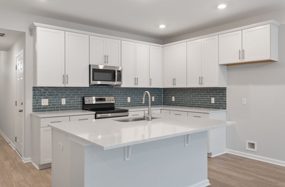 Furnished interior in a model home at 1158 Place Townhomes in Wilson (Image 6). Furnished interior in a model home at 1158 Place Townhomes in Wilson (Image 6).