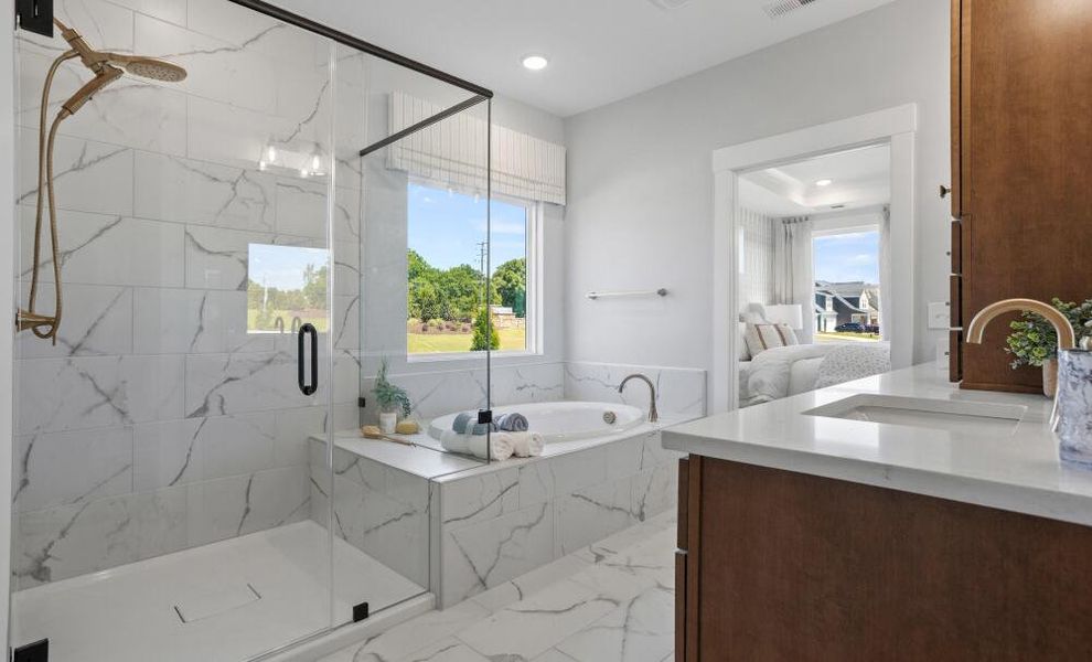 Furnished interior in a model home at The Enclave at Hidden Lake - 55+ Community in Youngsville (Image 15).