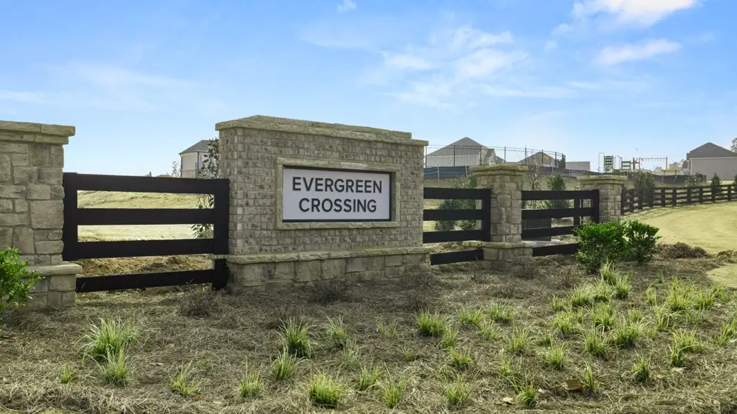 Entrance to the Evergreen Crossing community in Locust Grove, GA, featuring signage and landscaping (Image 1). Entrance to the Evergreen Crossing community in Locust Grove, GA, featuring signage and landscaping (Image 1).