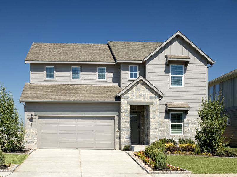 Front exterior of a home in the Prairie Winds - Boulevard Collection community, located in Hutto, TX (Image 4). Front exterior of a home in the Prairie Winds - Boulevard Collection community, located in Hutto, TX (Image 4).