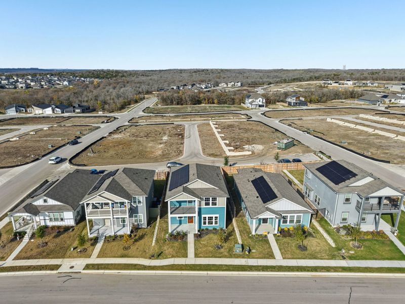 Aerial view of the Whisper Valley community in Manor, TX, showing layout and nearby surroundings (Image 8).