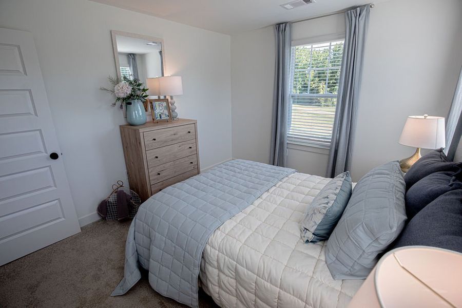 Furnished interior in a model home at The Townhomes at Union Depot in Bartlett (Image 34).