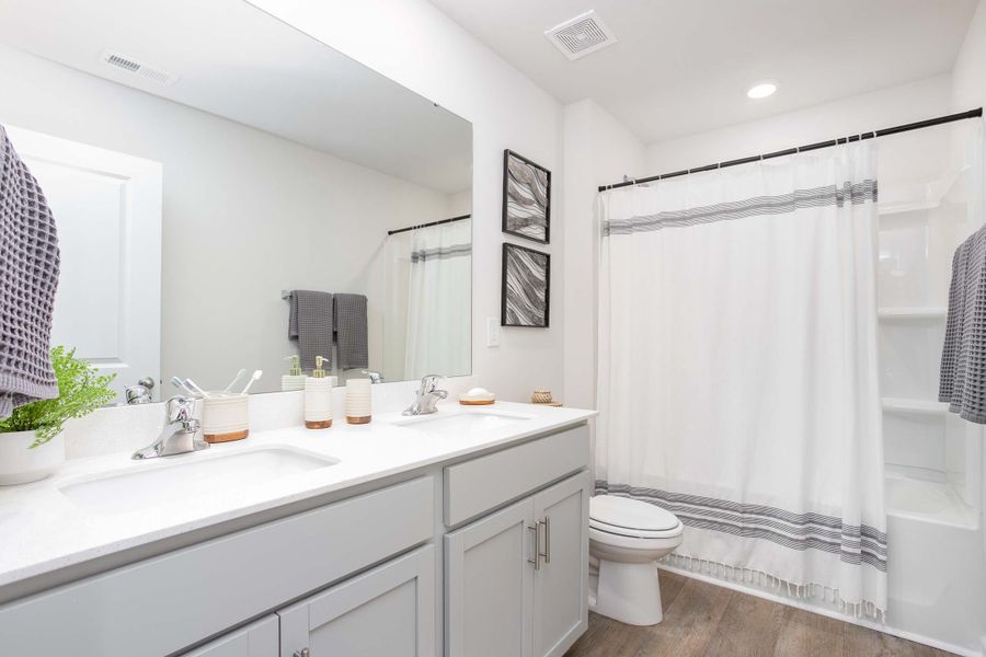 Furnished interior in a model home at Ridge Pointe in Trinity (Image 27).