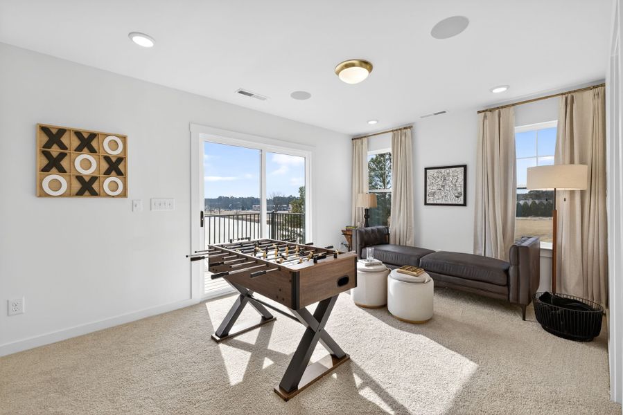 Furnished interior in a model home at North District at Flowers Plantation Townhomes in Clayton (Image 18).