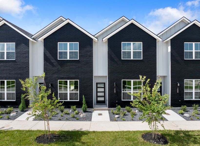 Front exterior of a home in the Midtown Townhomes community, located in College Station, TX (Image 1). Front exterior of a home in the Midtown Townhomes community, located in College Station, TX (Image 1).