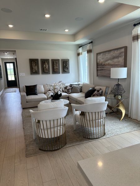 A stylish living room featuring plush seating, modern decor, and soft lighting, creating a cozy yet sophisticated ambiance. A stylish living room featuring plush seating, modern decor, and soft lighting, creating a cozy yet sophisticated ambiance.