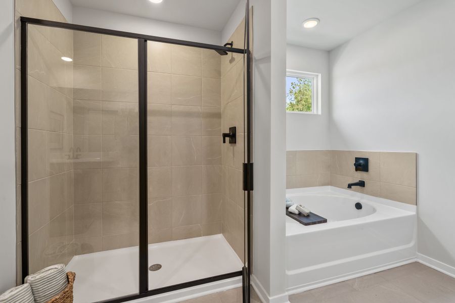 A bathroom with a glass shower.