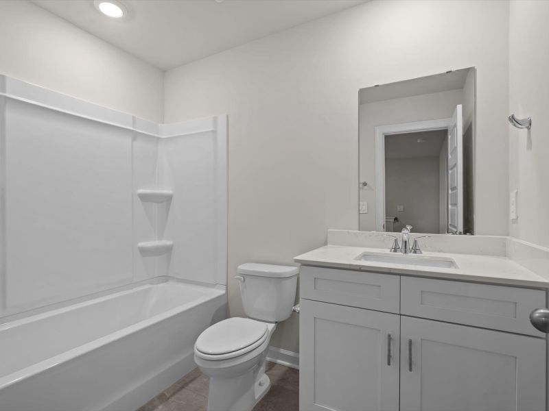 Furnished interior in a model home at Crossing at Abner Creek Townes in Greer (Image 6).