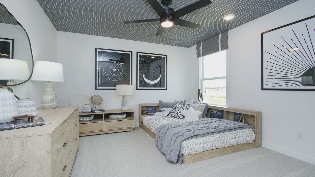 Sophisticated bedroom features chic decor, geometric ceiling, sleek wooden furniture, and expansive window in Pinehurst.