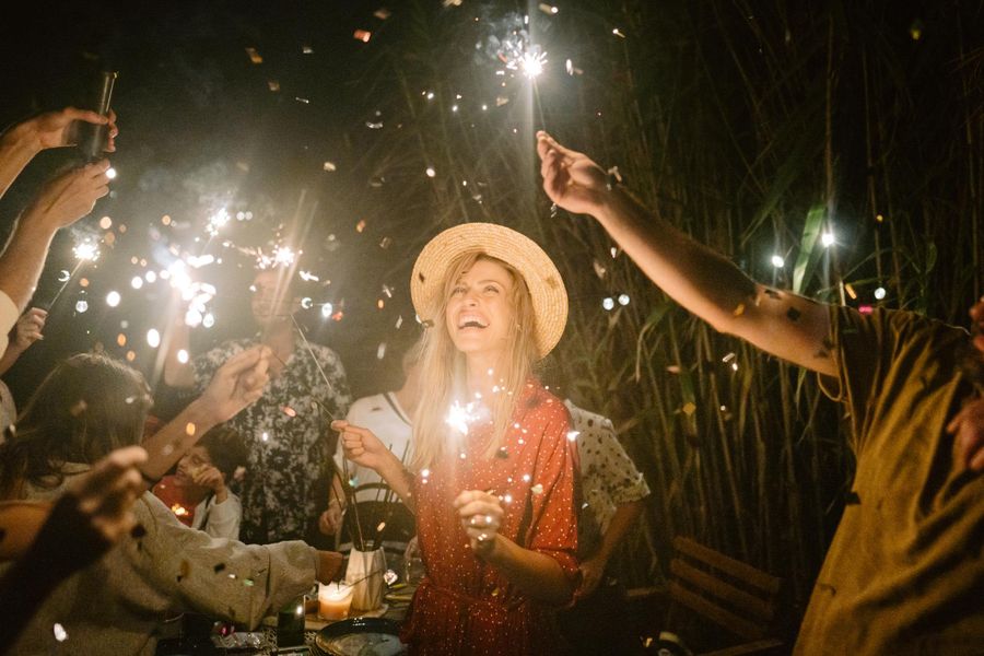 Woman Laughing and Holding Sparkler