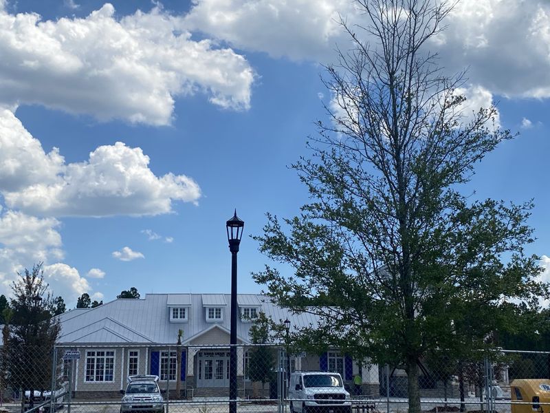 A modern home with metal roofing and large windows in SilverLeaf: Silver Meadows 60s by Lennar (St. Augustine, FL). A modern home with metal roofing and large windows in SilverLeaf: Silver Meadows 60s by Lennar (St. Augustine, FL).