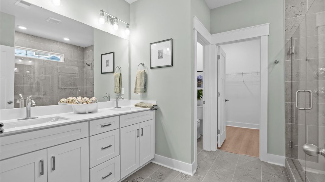 Primary bathroom designed for everyday comfort with elegant finishes throughout at Hinson Farm Primary bathroom designed for everyday comfort with elegant finishes throughout at Hinson Farm