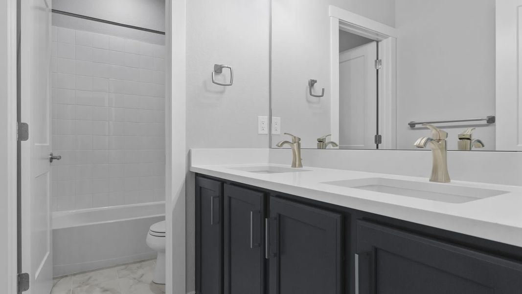 Experience elegance with dual sinks, sleek quartz surfaces, and premium fixtures in Montaine's refined setting.