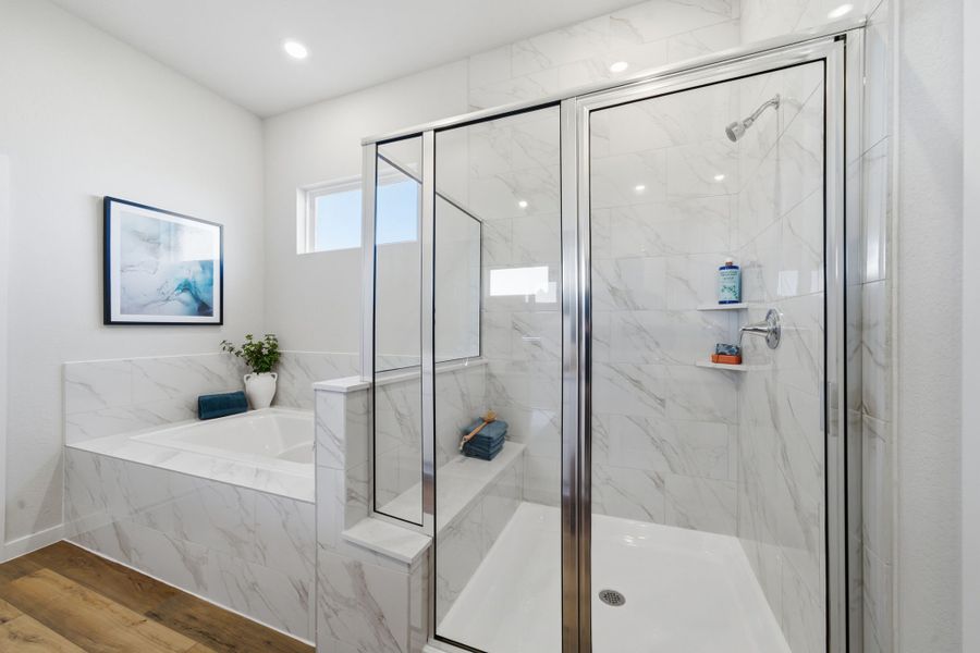 A bathroom with a glass shower.