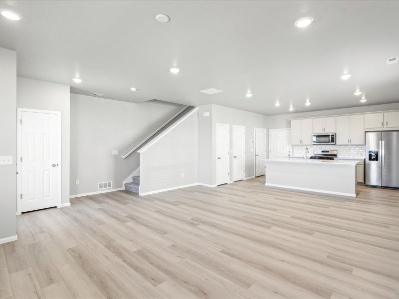 Dining area in the Woodland floorplan at a Meritage Homes community in Broomfield, CO.