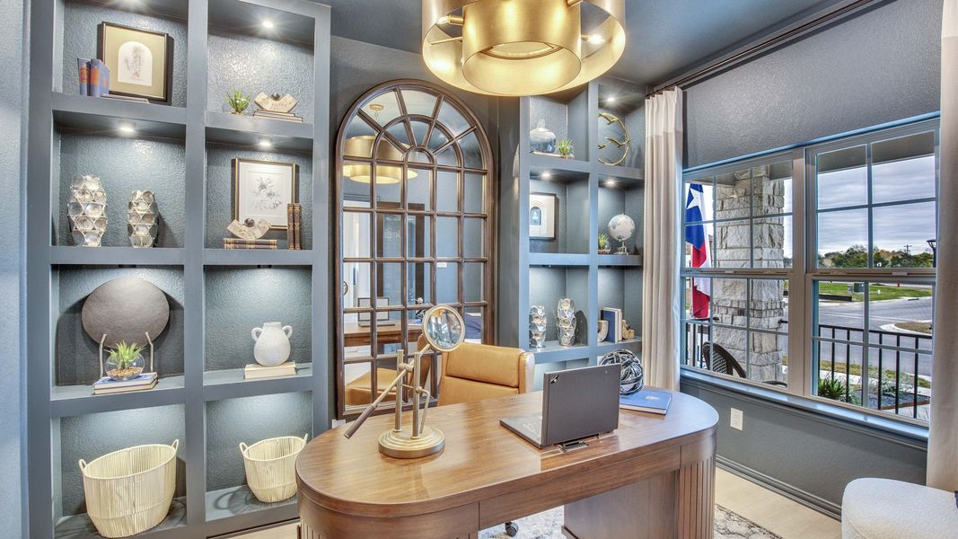Opal Ranch office boasts custom shelving, rich wood desk, and grand arched mirror, blending sophistication with modern design.