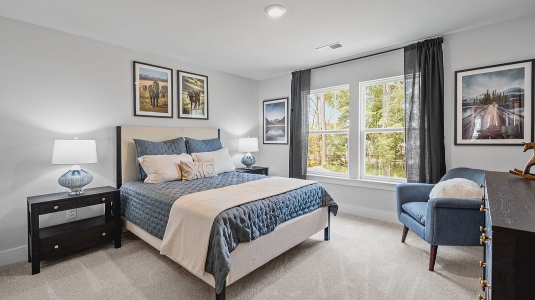 Cozy secondary bedroom with carpeted flooring, light colored walls, and large windows at Aspen Ridge in Lyman, SC Cozy secondary bedroom with carpeted flooring, light colored walls, and large windows at Aspen Ridge in Lyman, SC