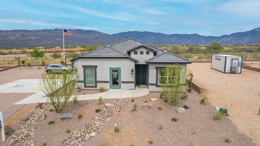 Front exterior of a home in the The Oasis at Rocking K community, located in Vail, AZ (Image 12).