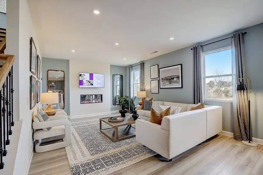 A living room with a large window. A living room with a large window.