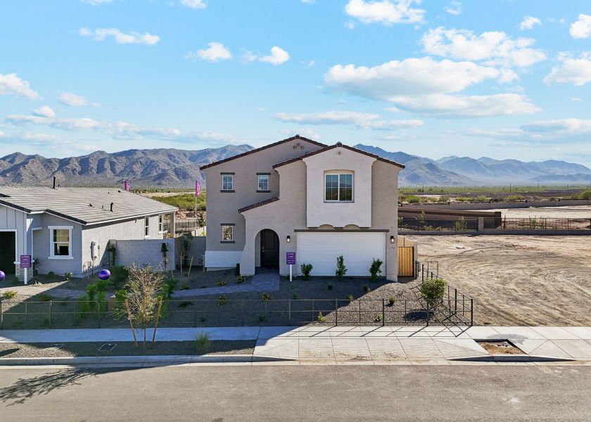 A white house with a fence around it. A white house with a fence around it.