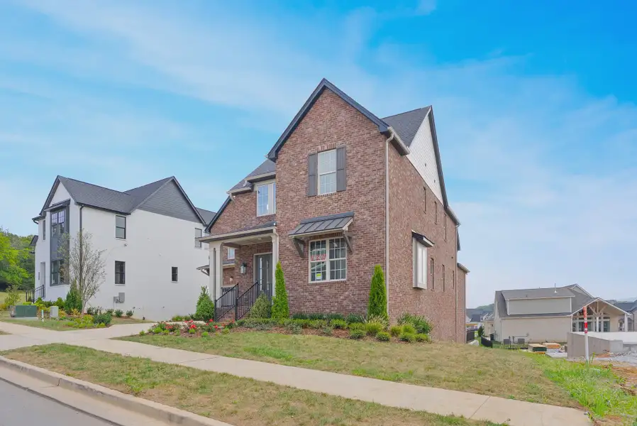 Front exterior of a home in the Poplar Farms community, located in Franklin, TN (Image 2).