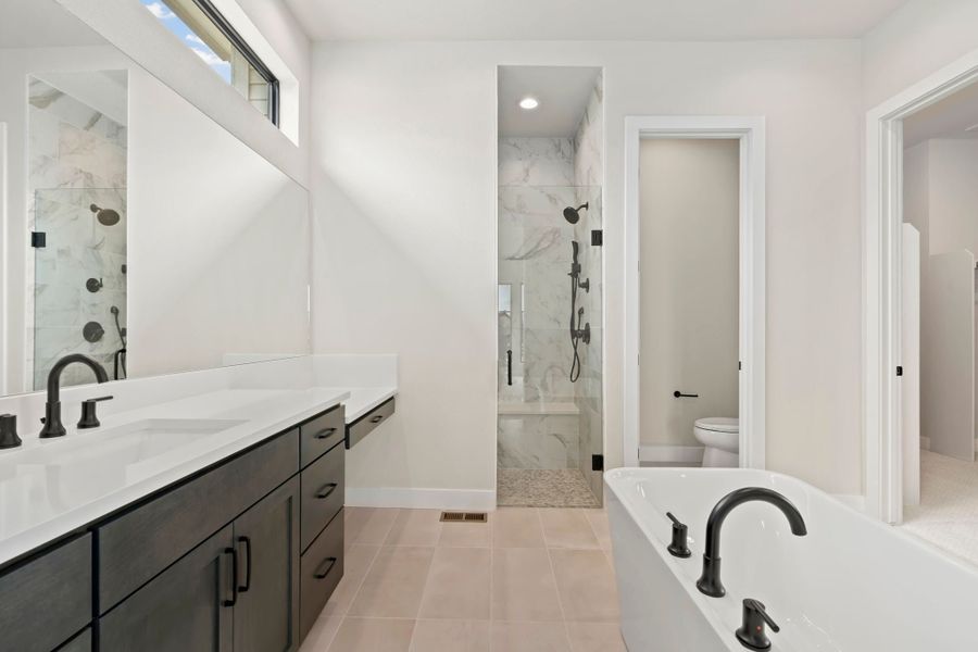 Furnished interior in a model home at Acadia at RainDance in Windsor (Image 19).