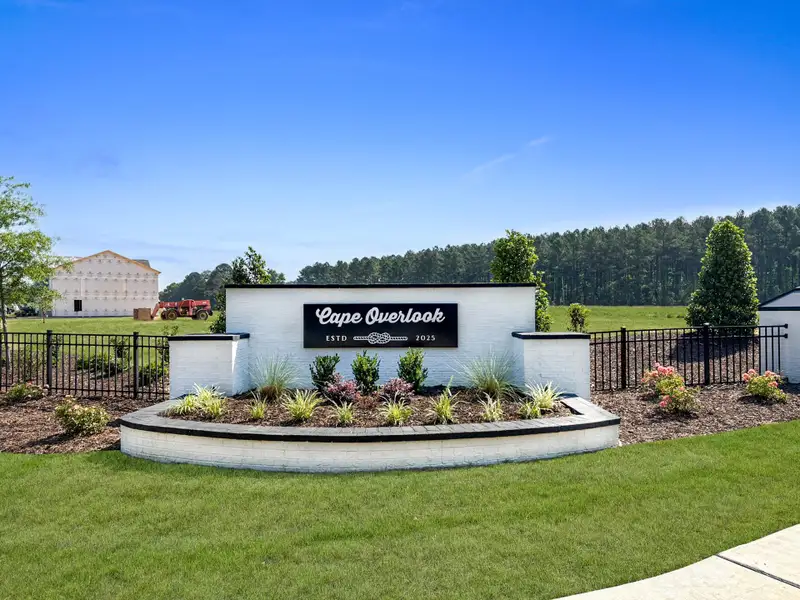 Entrance to the The Townes at Cape Overlook community in Lillington, NC, featuring signage and landscaping (Image 1). Entrance to the The Townes at Cape Overlook community in Lillington, NC, featuring signage and landscaping (Image 1).