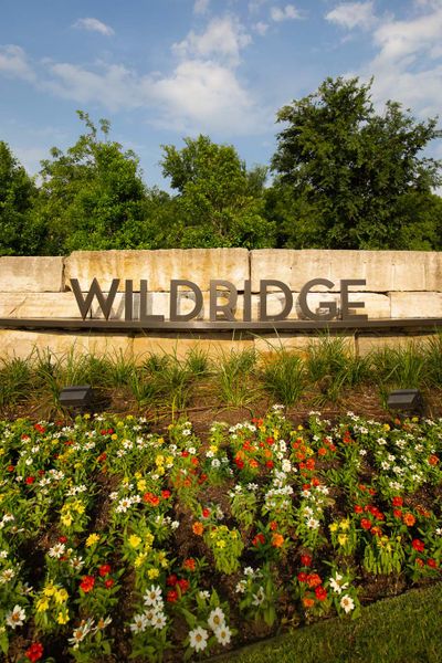 Entrance to the Wildridge community in Oak Point, TX, featuring signage and landscaping (Image 7). Entrance to the Wildridge community in Oak Point, TX, featuring signage and landscaping (Image 7).