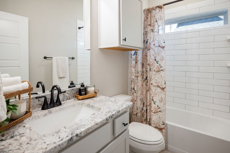 Furnished interior in a model home at Greens Prairie Reserve in College Station (Image 14).