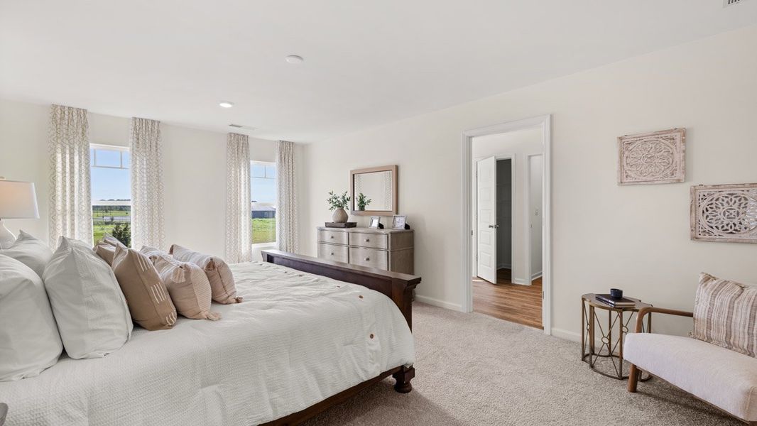 Furnished interior in a model home at Preserve at Dove Creek in Statham (Image 18).