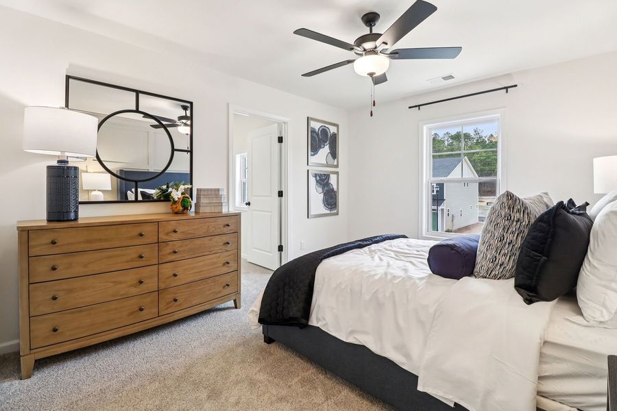 A bright and comfortable primary suite you'll look forward to coming home to
