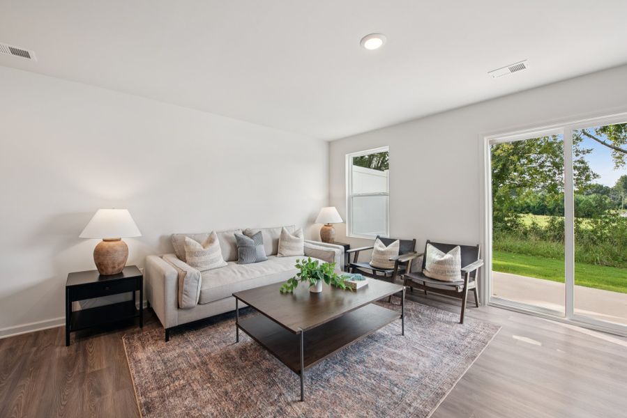 A living room with a large glass door.